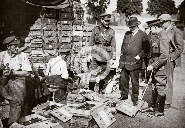Mr Asquith watching men adjusting fuses, Somme campaign, France, World War I, 1916. Creator: Unknown.