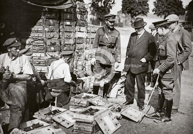 Mr Asquith watching men adjusting fuses, Somme campaign, France, World War I, 1916. Artist: Unknown