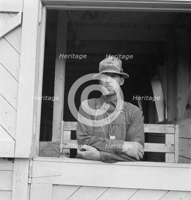 Mr. Granger, seen in doorway of his new barn, Yamhill County, Oregon, 1939. Creator: Dorothea Lange.