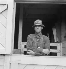 Mr. Granger, seen in doorway of his new barn, Yamhill County, Oregon, 1939. Creator: Dorothea Lange