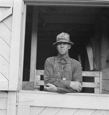 Mr. Granger, seen in doorway of his new barn, Yamhill County, Oregon, 1939. Creator: Dorothea Lange