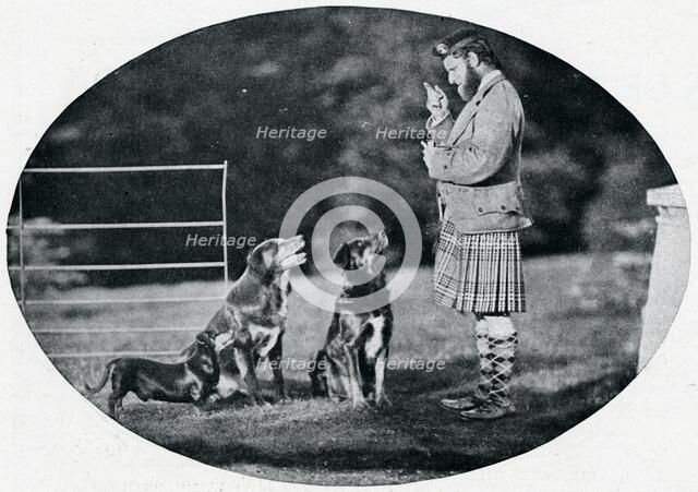 'Mr. Francis Clark, The Queen's Gillie, with three of her favourite dogs', c1899, (1901). Artist: GW Wilson and Company.