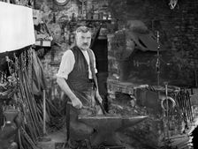 Mr Jefferies at work in the forge, Southrop, Cotswolds, Gloucestershire, 1938. Creator: Sydney Alfred Pitcher