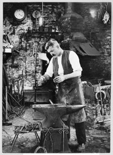Mr Jefferies at work in the forge, Southrop, Cotswolds, Gloucestershire, 1938. Creator: Sydney Alfred Pitcher