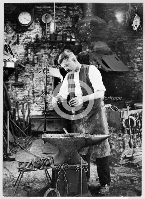 Mr Jefferies at work in the forge, Southrop, Cotswolds, Gloucestershire, 1938. Creator: Sydney Alfred Pitcher.