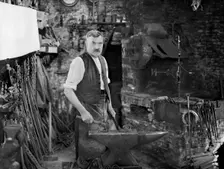 Mr Jefferies at work in the forge, Southrop, Cotswolds, Gloucestershire, 1938. Creator: Sydney Alfred Pitcher