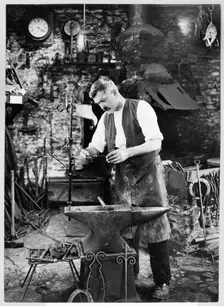 Mr Jefferies at work in the forge, Southrop, Cotswolds, Gloucestershire, 1938. Creator: Sydney Alfred Pitcher