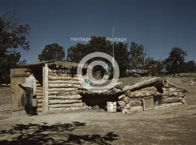 Mr. Leatherman, homesteader, coming out of his dugout home, Pie Town, New Mexico, 1940. Creator: Russell Lee.