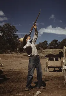 Mr. Leatherman, homesteader, shooting hawks..., Pie Town, New Mexico, 1940. Creator: Russell Lee