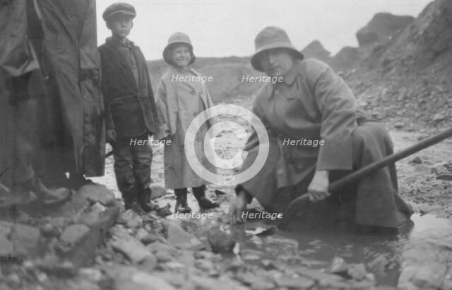 Mr. Lindeberg panning gold at Pioneer Mine with a shovel, between c1900 and 1916. Creator: Unknown.