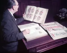 Mr. Mitchell (Herald Painter) in Records Room, College of Arms, London, c1953. Creator: Arthur Charles Kirby Ware