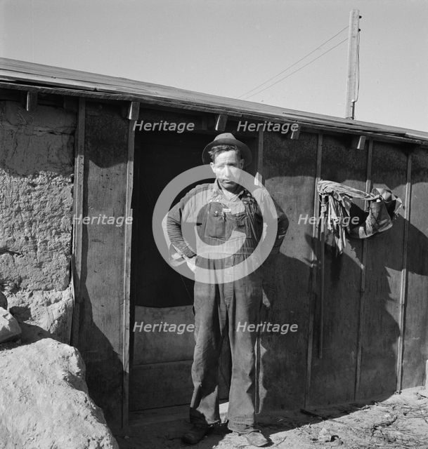 Mr. Roberts in front of his Owyhee project home, Malheur County, Oregon, 1939. Creator: Dorothea Lange.