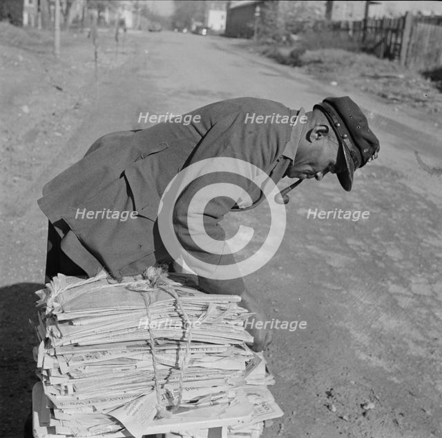 Mr. Venus Alsobrook, official salvage collector for the government, Washington, D.C., 1942. Creator: Gordon Parks.