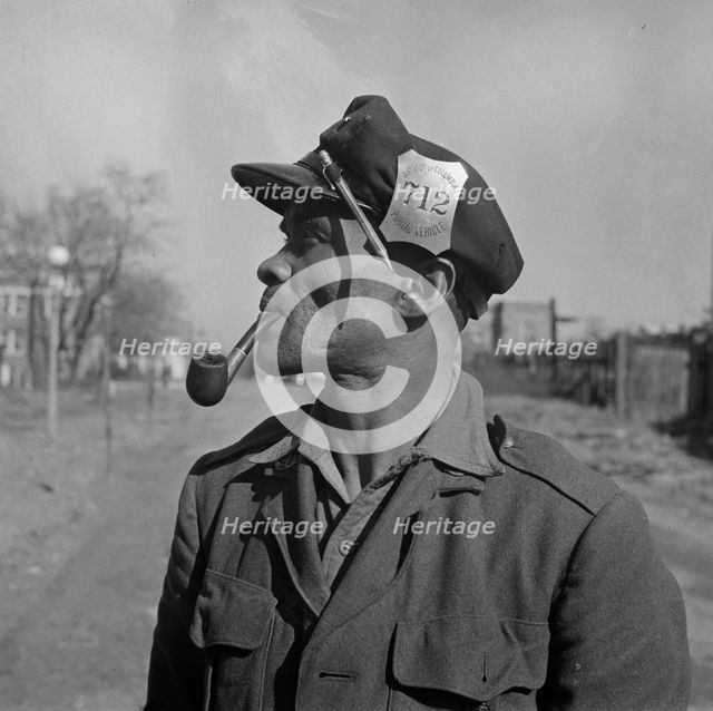 Mr. Venus Alsobrook official salvage collector for the government, Washington, D.C., 1942. Creator: Gordon Parks.