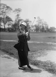 Mrs. Mann Playing Golf, 1916. Creator: Harris & Ewing