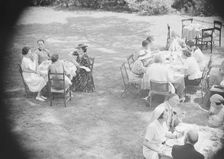 Mrs. Mary Benson and others, seated outdoors, between 1933 and 1942. Creator: Arnold Genthe