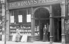 Mrs May looking in the window of the Woman's Press shop, London, 1910. Creator: Unknown