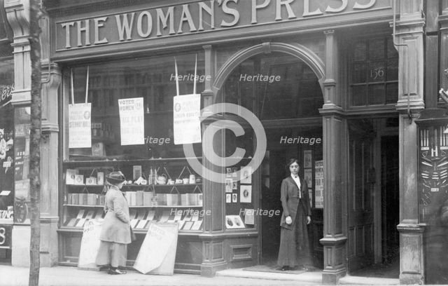 Mrs May looking in the window of the Woman's Press shop, London, 1910. Creator: Unknown.