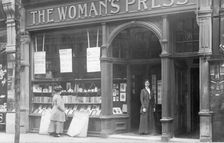 Mrs May looking in the window of the Woman's Press shop, London, 1910