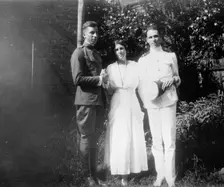 Mrs. Abby Scott Baker And Sons, 1917 or 1918. Creator: Harris & Ewing