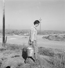 Mrs. Bartheloma hauls water from irrigation ditch, Nyssa Heights, Malheur County, Oregon, 1939. Creator: Dorothea Lange