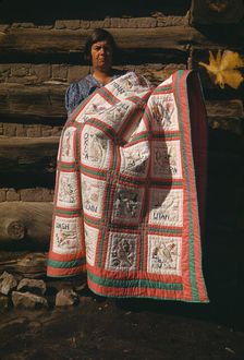 Mrs. Bill Stagg with state quilt which she made, Pie Town, New Mexico, 1940. Creator: Russell Lee