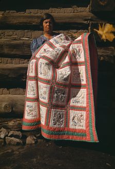 Mrs. Bill Stagg with state quilt which she made, Pie Town, New Mexico, 1940. Creator: Russell Lee