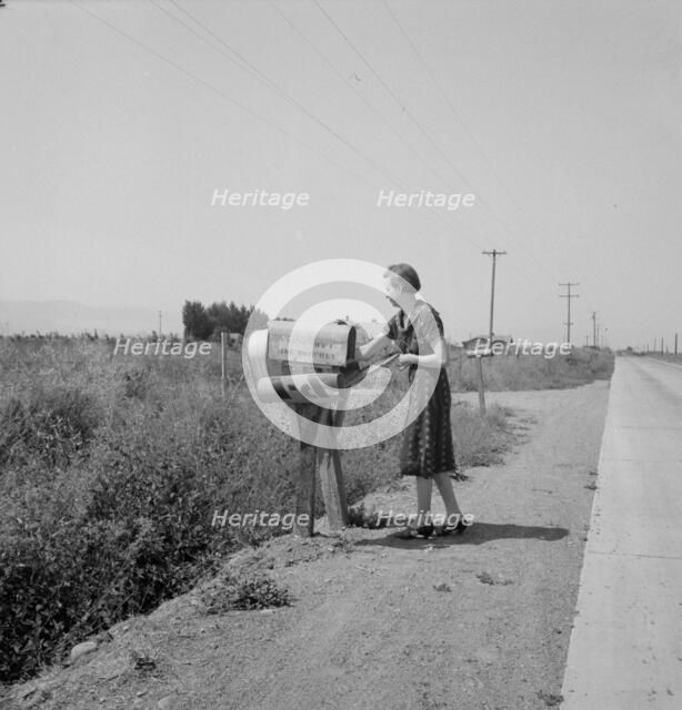 Mrs. Bouchey gets the morning mail, Washington, Yakima Valley, near Toppenish, 1939. Creator: Dorothea Lange.
