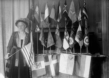 Mrs. Carrie Chapman Catt with Flags of 22 Nations, 1917. Creator: Harris & Ewing
