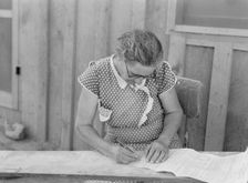 Mrs. Cates signs chattel mortgage with "X", Malheur County, Oregon, 1939. Creator: Dorothea Lange