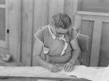 Mrs. Cates signs chattel mortgage with "X", Malheur County, Oregon, 1939. Creator: Dorothea Lange