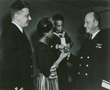 Mrs. Charles W. David, Jr.; African American widow and her three-year-old son, Neil..., 1939 - 1945. Creator: United States Coast Guard