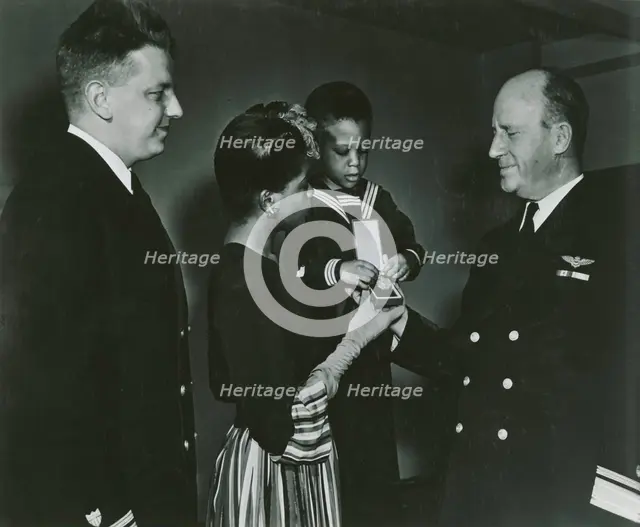 Mrs. Charles W. David, Jr.; African American widow and her three-year-old son, Neil..., 1939 - 1945. Creator: United States Coast Guard.