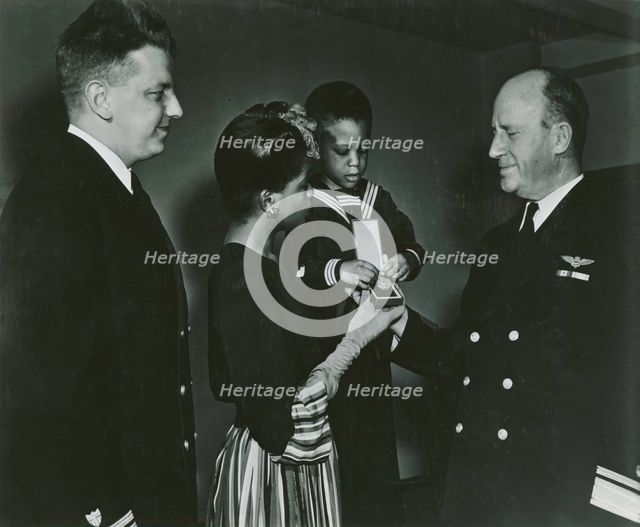 Mrs. Charles W. David, Jr.; African American widow and her three-year-old son, Neil..., 1939 - 1945. Creator: United States Coast Guard.