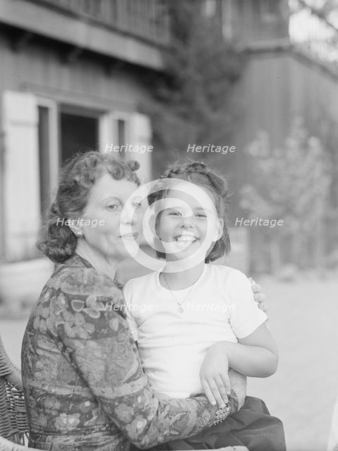 Mrs. Churchill with child Orrin, seated outdoors, not before 1932 Mar. Creator: Arnold Genthe.