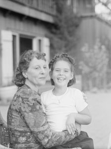 Mrs. Churchill with child Orrin, seated outdoors, not before 1932 Mar. Creator: Arnold Genthe
