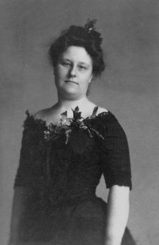 Mrs. Crabbe, half-length portrait, standing, facing front, between c1890 and 1910. Creator: Frances Benjamin Johnston