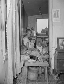 Mrs. Ella Watson, a government charwoman and her grandchildren, Washington, D.C., 1942. Creator: Gordon Parks