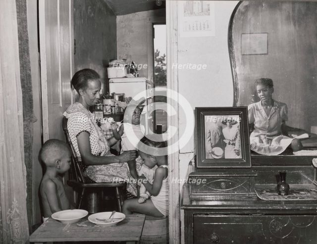 Mrs. Ella Watson, a government charwoman..., Washington, D.C., 1942. Creator: Gordon Parks.