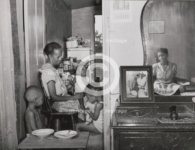 Mrs. Ella Watson, a government charwoman..., Washington, D.C., 1942. Creator: Gordon Parks.