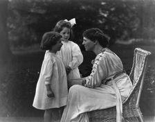 Mrs. Frank Vanderlip seated on porch, with two children, not after 1913. Creator: Frances Benjamin Johnston