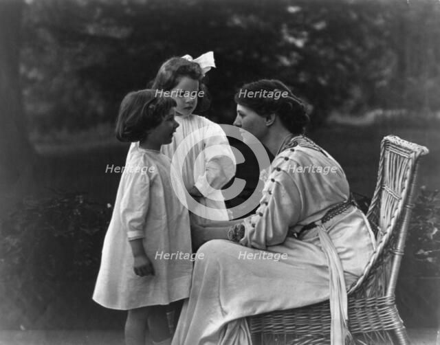 Mrs. Frank Vanderlip seated on porch, with two children, not after 1913. Creator: Frances Benjamin Johnston.