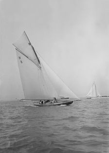 Mrs GA Shenley at the helm of the 8 Metre class Spero (H8). Creator: Kirk & Sons of Cowes