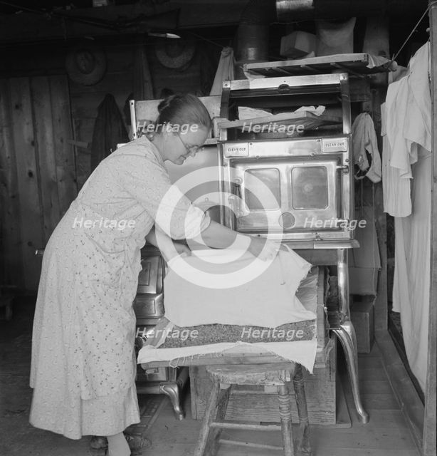 Mrs. Hull drying corn, Dead Ox Flat, Malheur County, Oregon, 1939. Creator: Dorothea Lange.