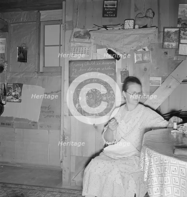 Mrs. Hull in one-room dugout basement home, Dead Ox Flat, Malheur County, Oregon, 1939. Creator: Dorothea Lange.