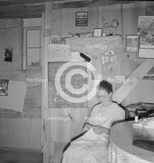 Mrs. Hull in one-room dugout basement home, Dead Ox Flat, Malheur County, Oregon, 1939. Creator: Dorothea Lange.