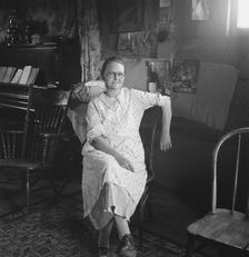 Mrs. Hull in one-room dugout basement home, Dead Ox Flat, Malheur County, Oregon, 1939. Creator: Dorothea Lange
