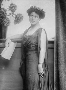 Mrs. Inez Milholland posing with scroll of paper, 1910. Creator: Bain News Service