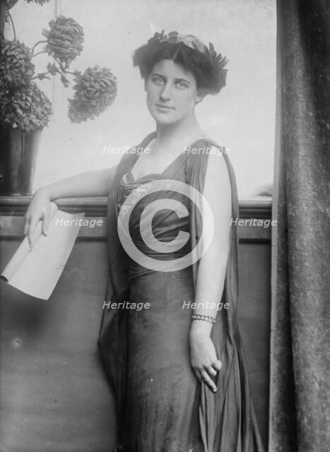 Mrs. Inez Milholland posing with scroll of paper, 1910. Creator: Bain News Service.