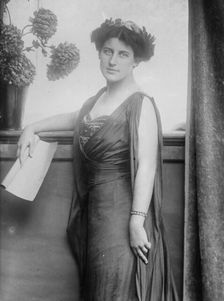 Mrs. Inez Milholland posing with scroll of paper, 1910. Creator: Bain News Service